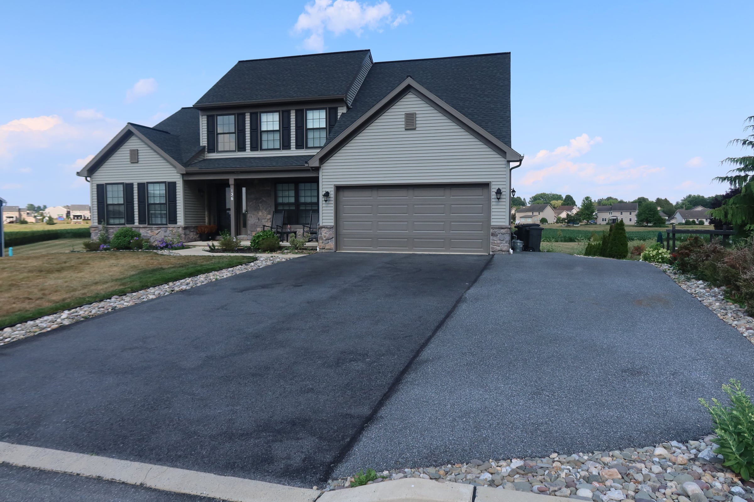 Residential driveway sealcoating before and after comparison