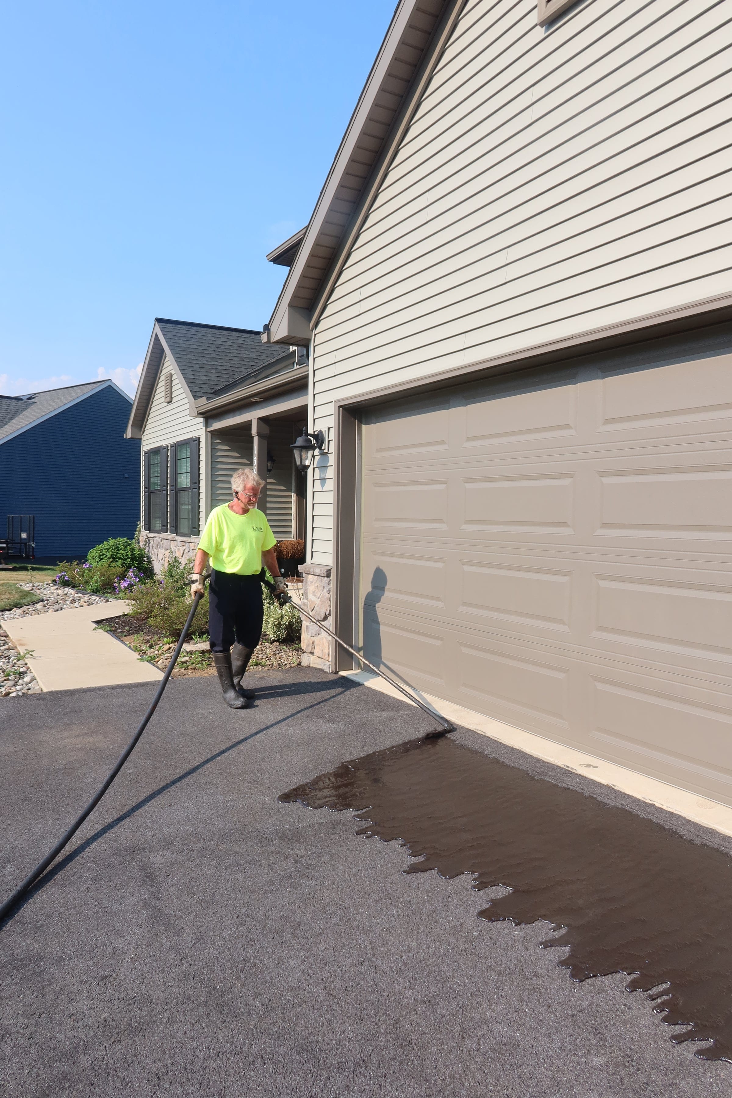 Sealcoating at garage apron — R. Youtz Asphalt Maintenance